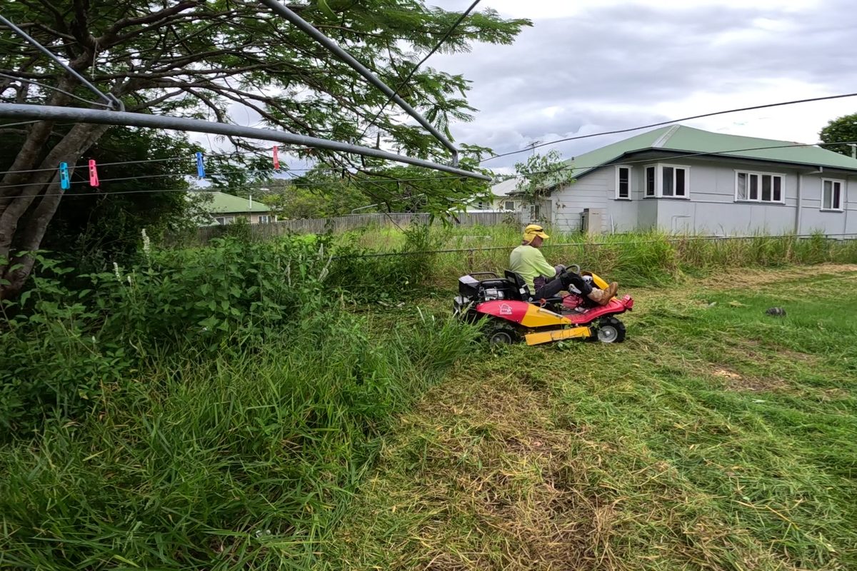Ride-on mowing through longer grass
